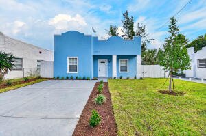 Single-family home for sale at 3804 Greenwood Avenue, West Palm Beach, FL 33407, with a wide concrete driveway